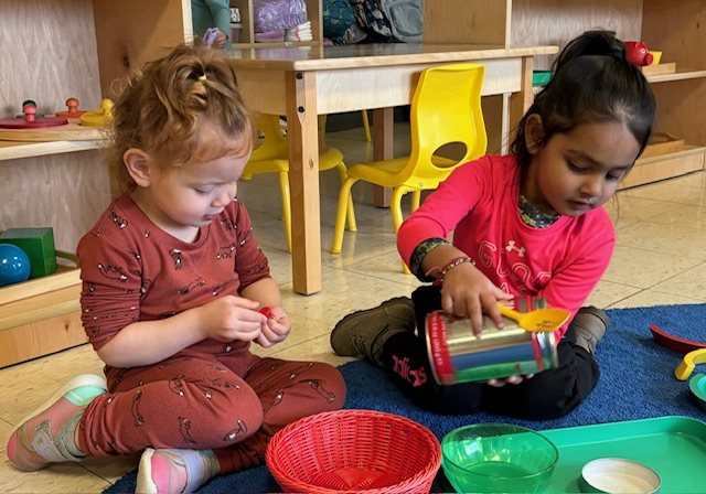 Montessori students exploring hands-on materials